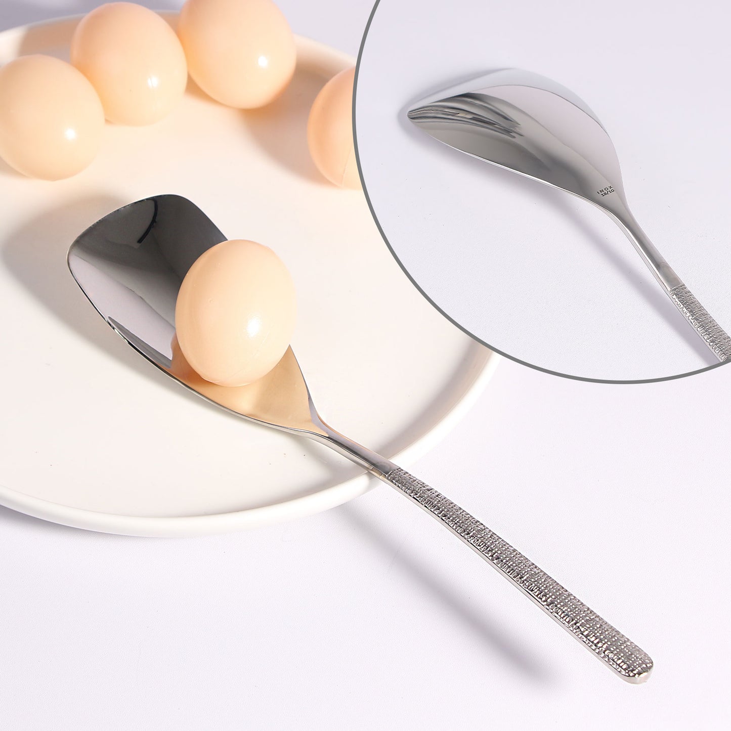 IMEEA 18/10 Stainless Steel Buffet Spoon scooping eggs with a slightly squared-off head for versatile kitchen use