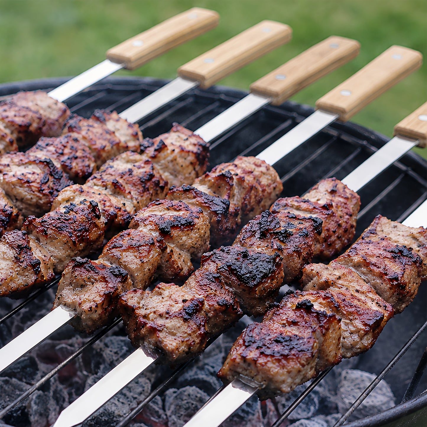 Stainless steel kabob skewer used for grilling meat on a grill