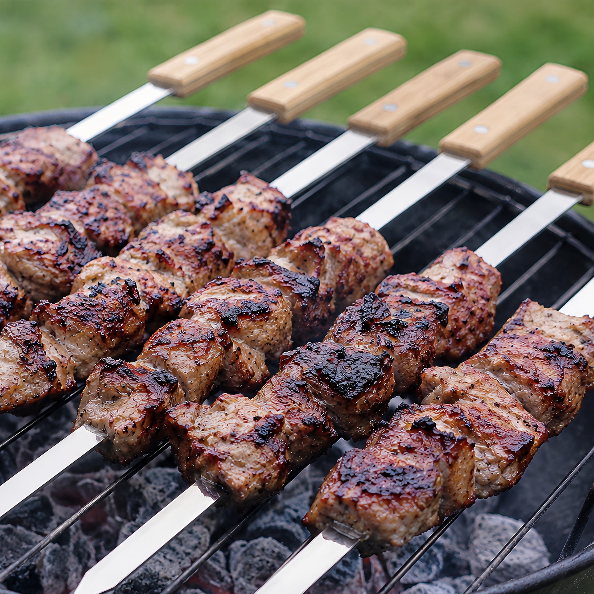 Stainless steel kabob skewer used for grilling meat on a grill