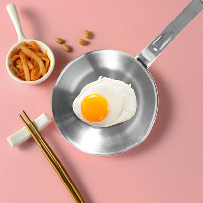 Breakfast Mini Egg Pan with fried egg on a tabletop breakfast setup