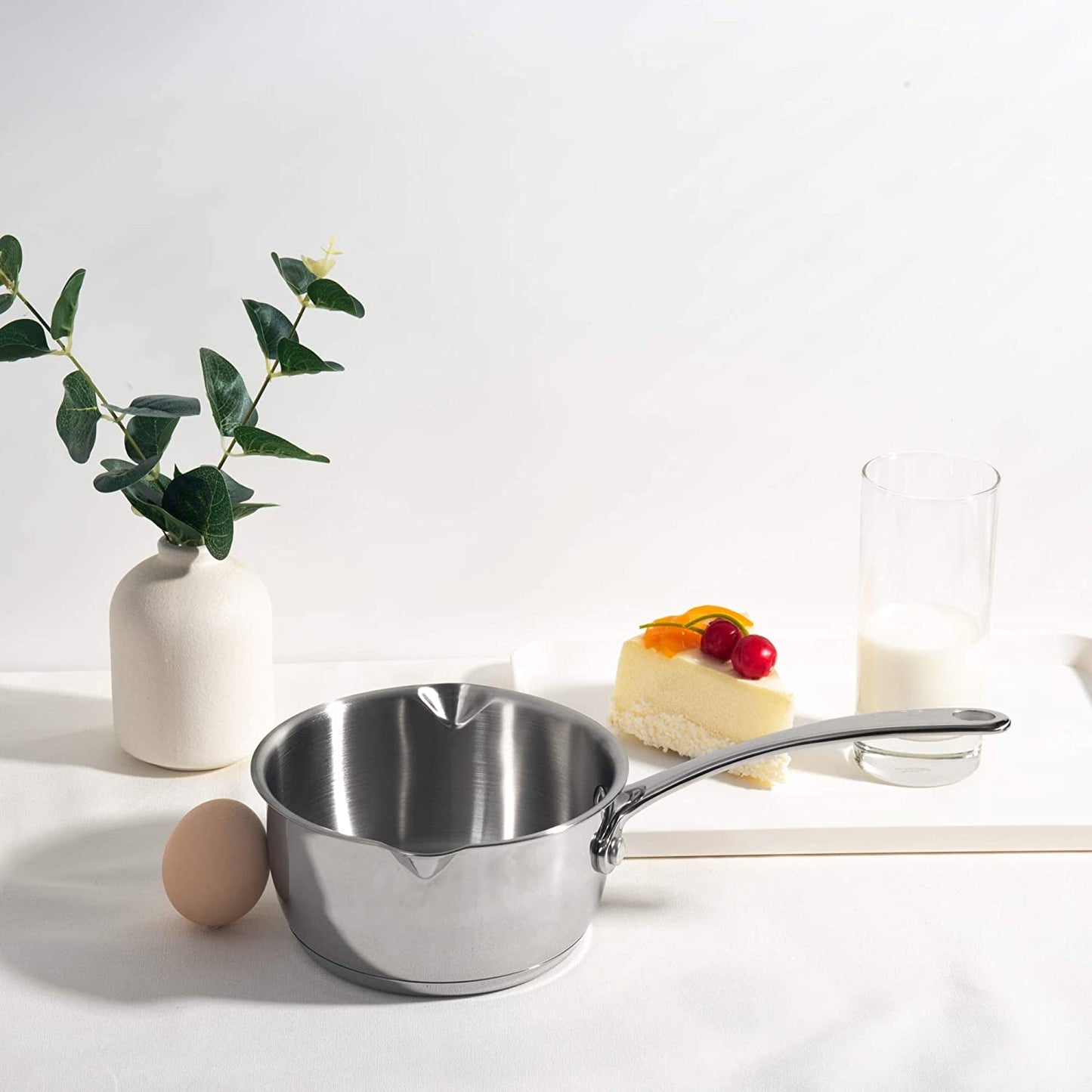 IMEEA Butter Melting Pot on a table showcasing a stainless steel design for daily home use