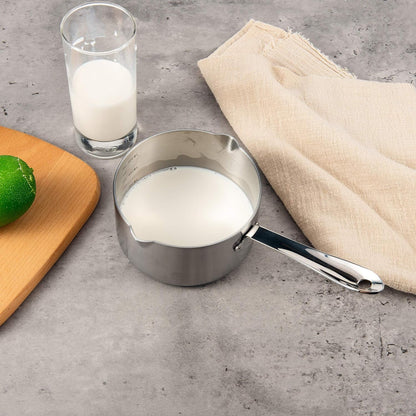 IMEEA Stainless Steel Butter Warmer filled with warm milk placed on a table