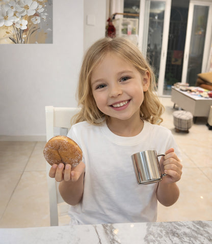 IMEEA stainless steel camping mug held in a child's hand with multiple size options for different needs