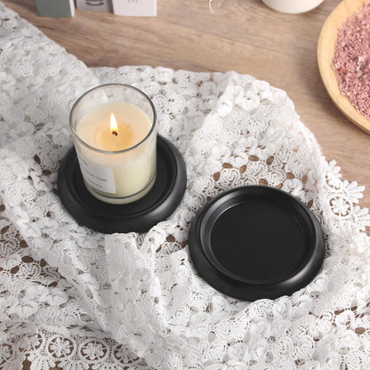 Black Stainless Steel Candle Holder Plate set of 2 with pillar candles on tabletop, top view