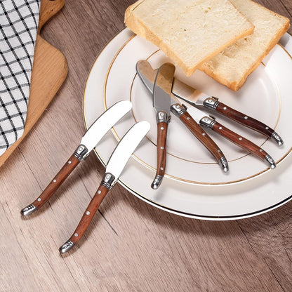 IMEEA butter spreader set placed on a plate, showcasing the wood handle design and stainless steel blade