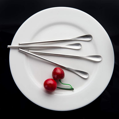 Elegant SUS304 Stainless Steel Coffee Stir Spoons placed on a plate with a refined dining table setting