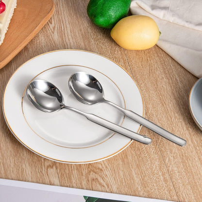 Elegant IMEEA 316 Stainless Steel Round Bowl Dinner Spoons placed on a dining plate
