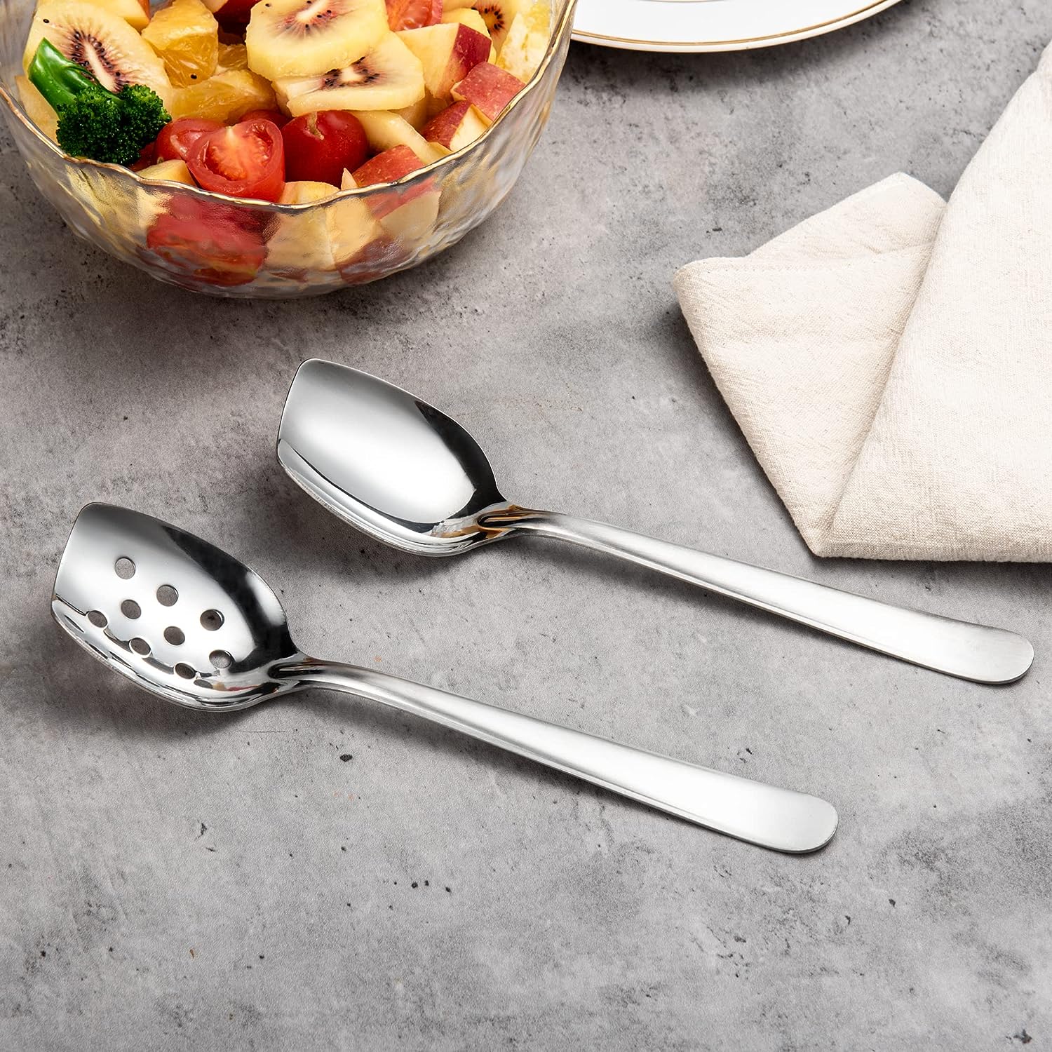 Elegant Table Setting with Stainless Steel Flat Edge Spoon Set displayed on a dining table, showcasing its versatile serving design