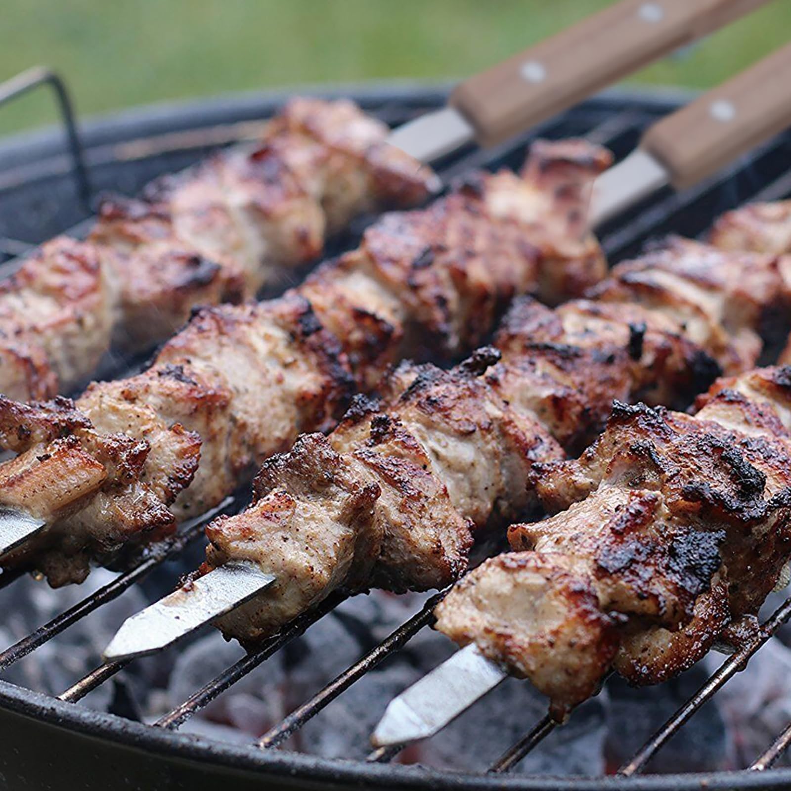 IMEEA Stainless Steel BBQ Skewers with meat grilling on a barbecue rack for delicious homemade meals