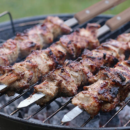 IMEEA Stainless Steel BBQ Skewers with meat grilling on a barbecue rack for delicious homemade meals