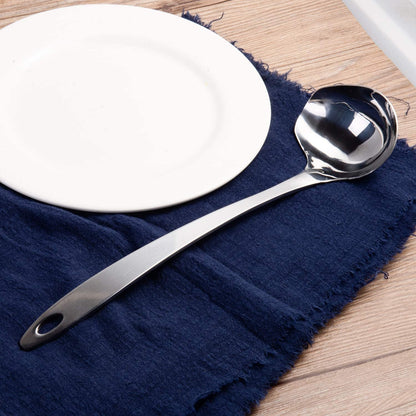 IMEEA Stainless Steel Gravy Ladle with Ergonomic Handle on a dining table