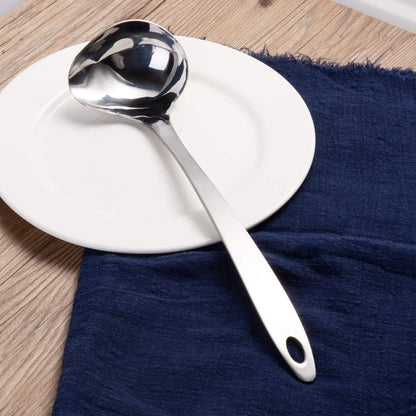IMEEA Stainless Steel Gravy Ladle with Long Handle displayed on a dining plate