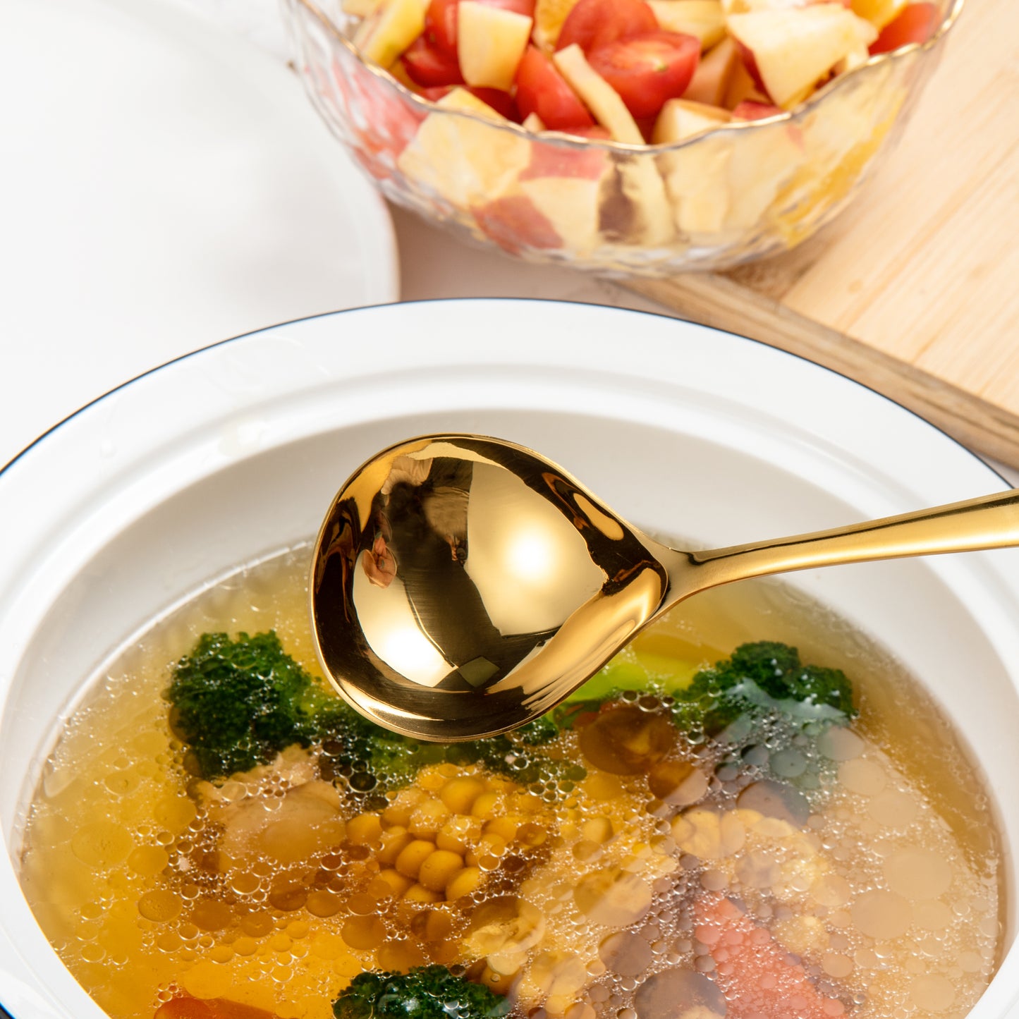 IMEEA Gold Stainless Steel Gravy Ladle close-up showcasing the elegant polished spoon head above a warm soup bowl