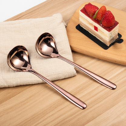 IMEEA Rose Gold Sauce Ladles placed on a table showcasing the warm metallic finish and coordinated pair design