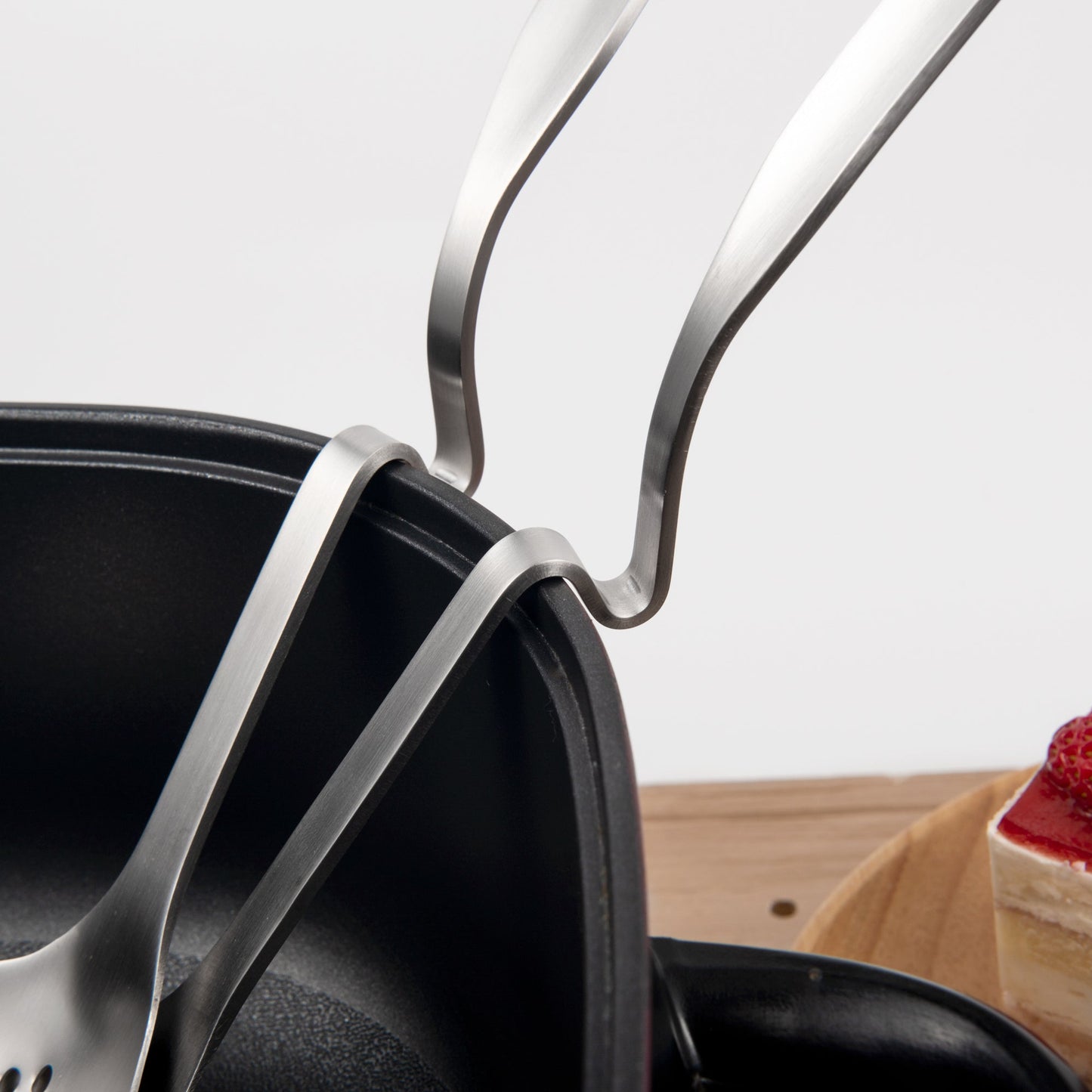 Stainless steel ladle with ergonomic curved handle for safe and convenient use
