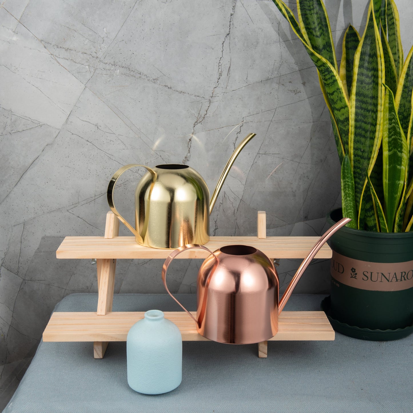 Morden Gold and Rose Gold Stainless Steel Indoor Watering Can 33oz on a plant shelf