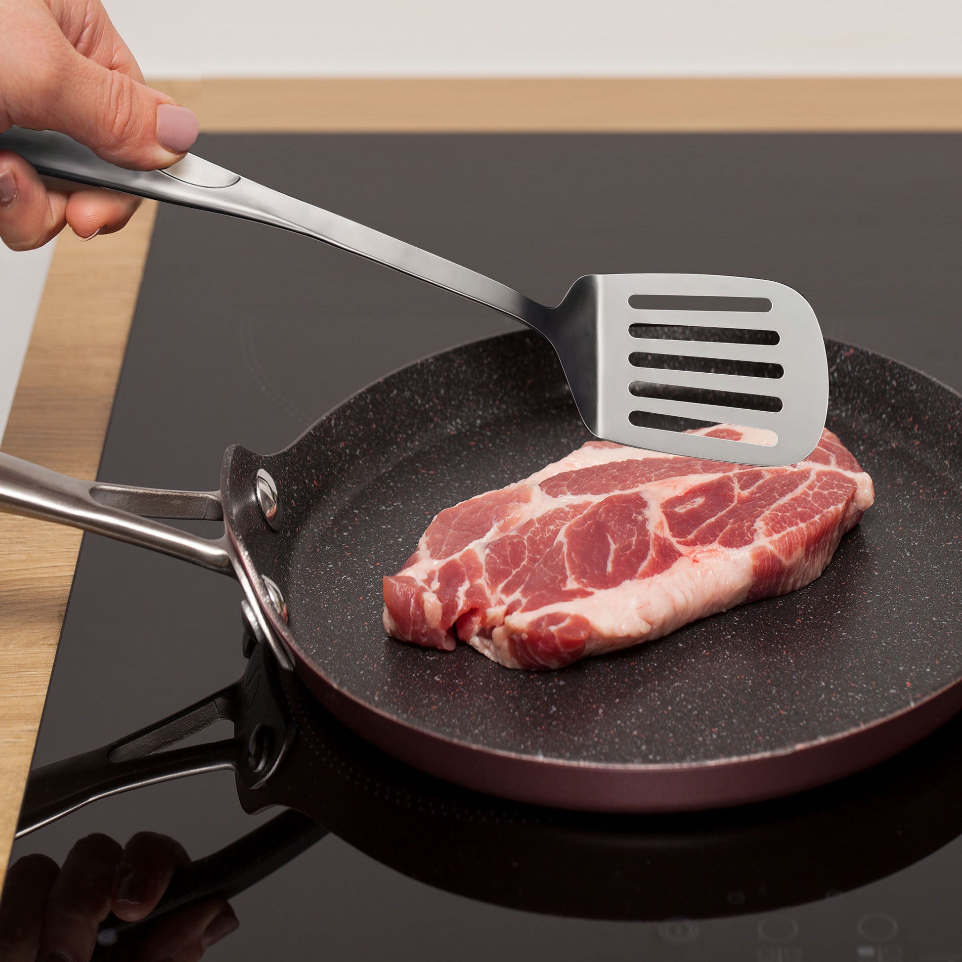 Stainless steel slotted turner for flipping and frying food