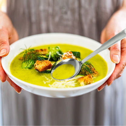 SUS304 stainless steel serving spoon set in a soup bowl, highlighting large capacity for soups and dishes