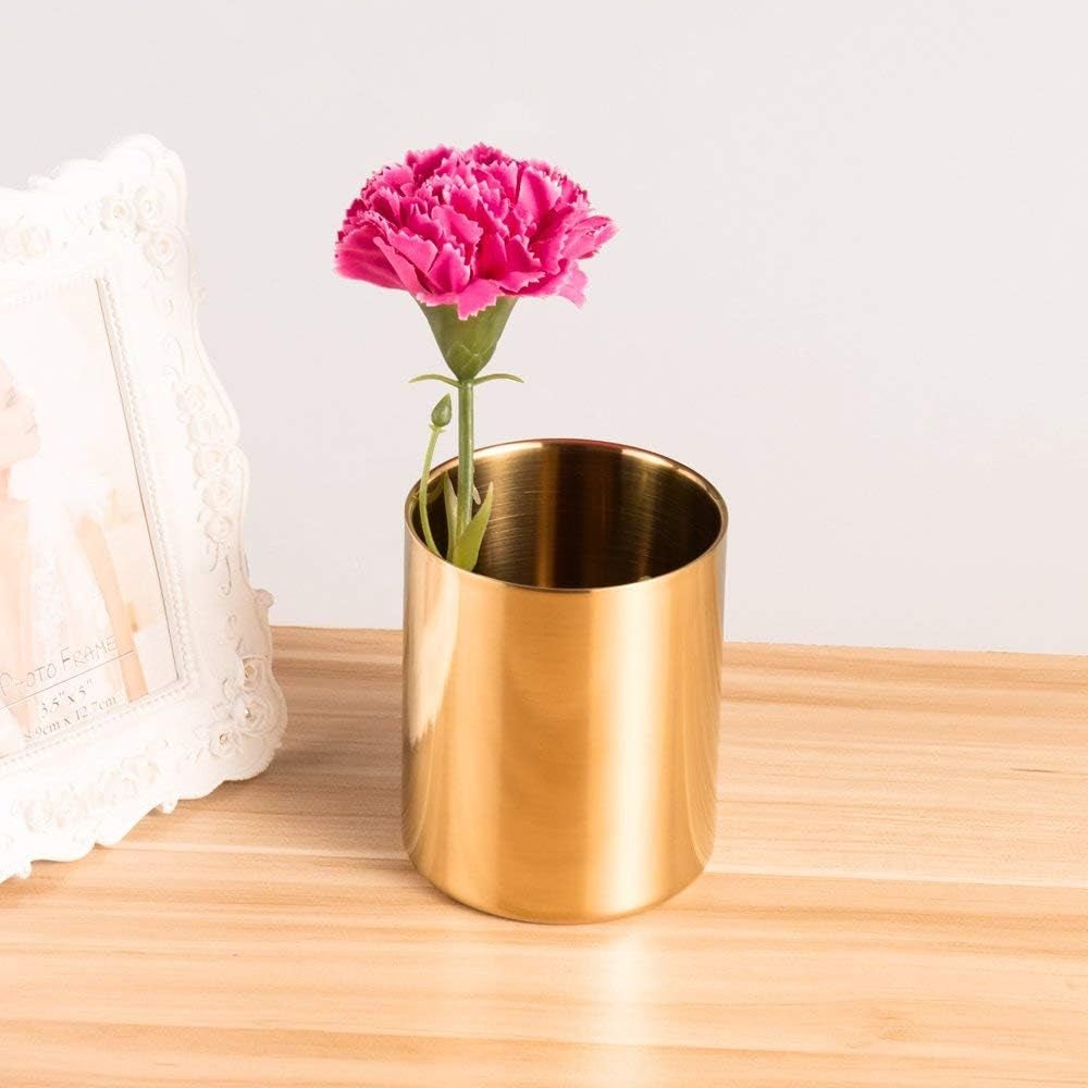 Sleek gold makeup organizer with a flower accent for a cozy desk display