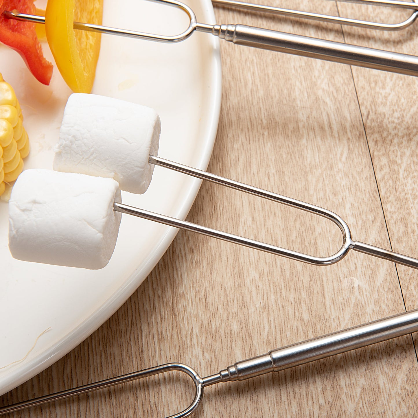 Stainless Steel Marshmallow Roasting Sticks with vegetables and marshmallows showcasing versatile food use