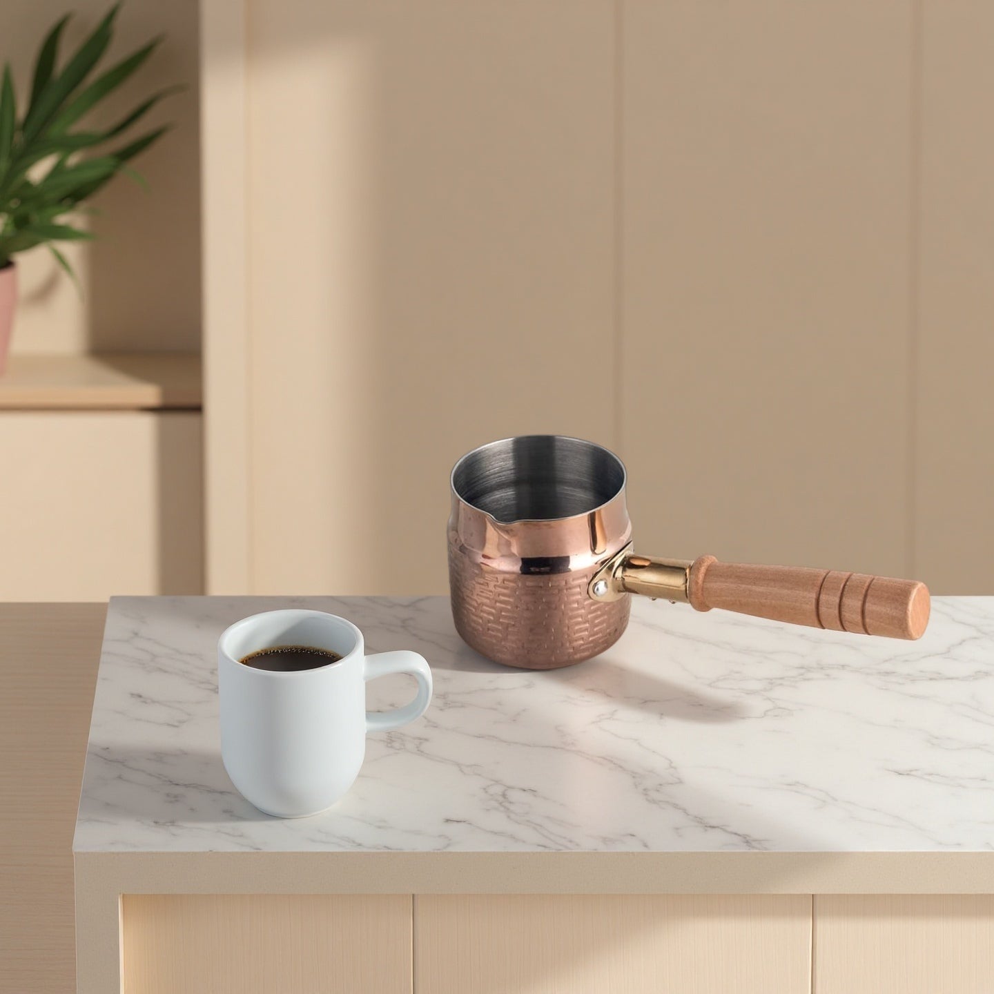 Stainless Steel Milk Warmer Pot placed on a table with elegant kitchen styling