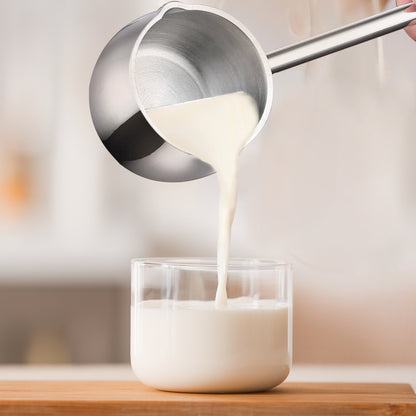 IMEEA Mini Saucepan pouring warm milk into a cup for daily beverage preparation