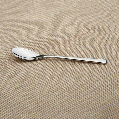Mirror polished espresso spoons placed on a tablecloth, showcasing a sleek stainless steel design