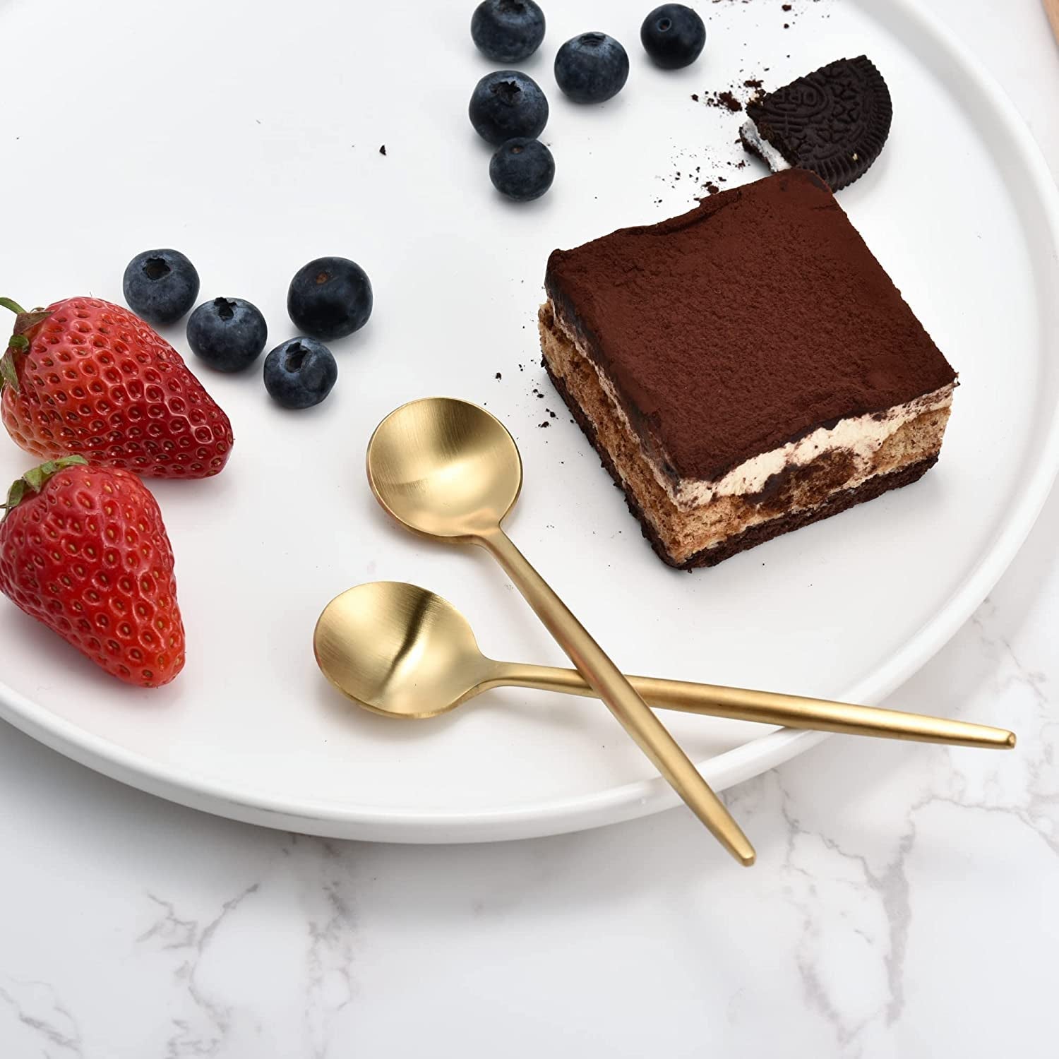 Mini Teaspoons with matte gold finish on a dessert tray