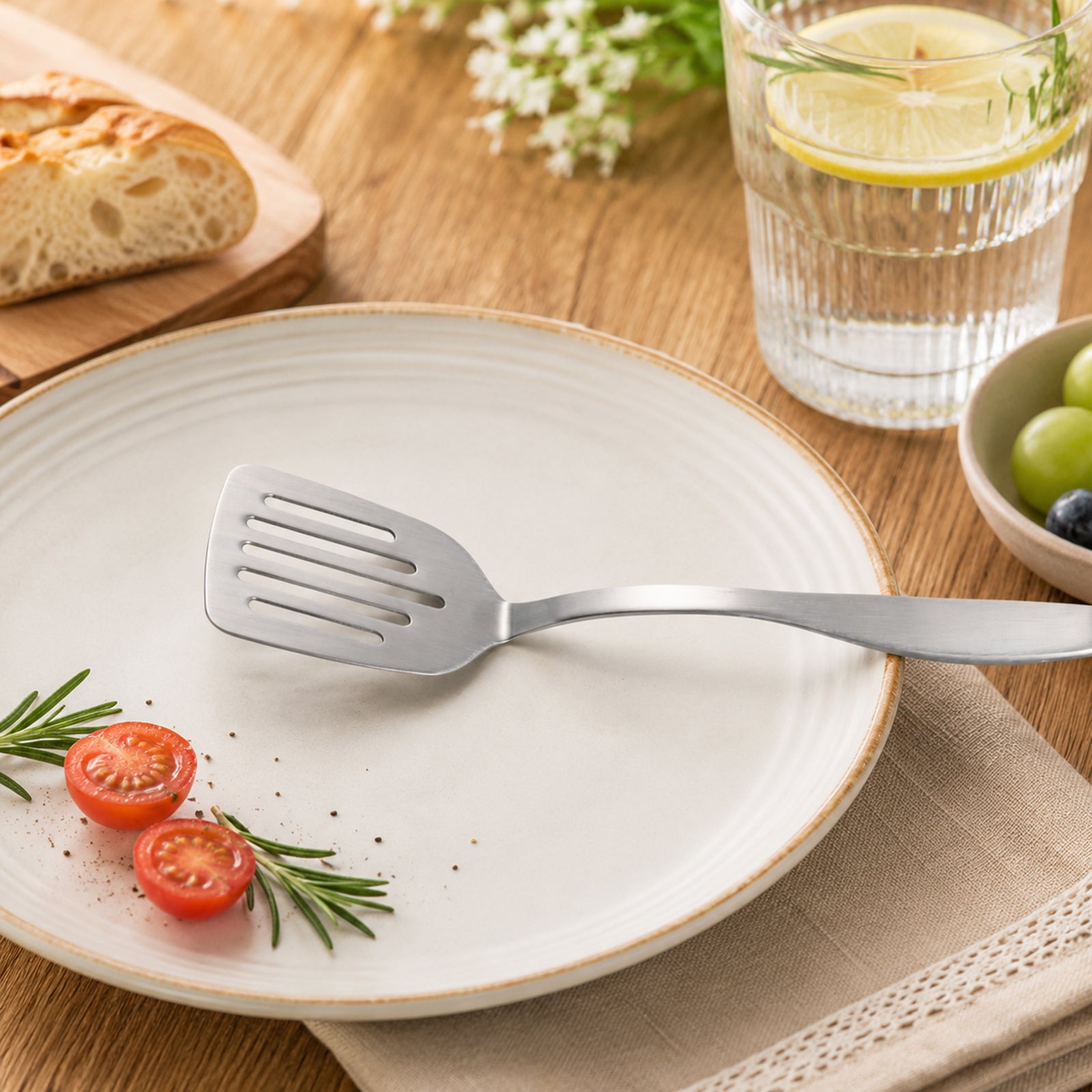Compact Stainless Steel Mini Turner 9.5inch placed on serving plate, adding a simple touch to everyday dining