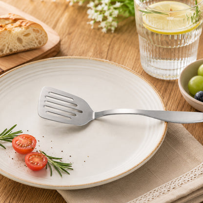 Compact Stainless Steel Mini Turner 9.5inch placed on serving plate, adding a simple touch to everyday dining