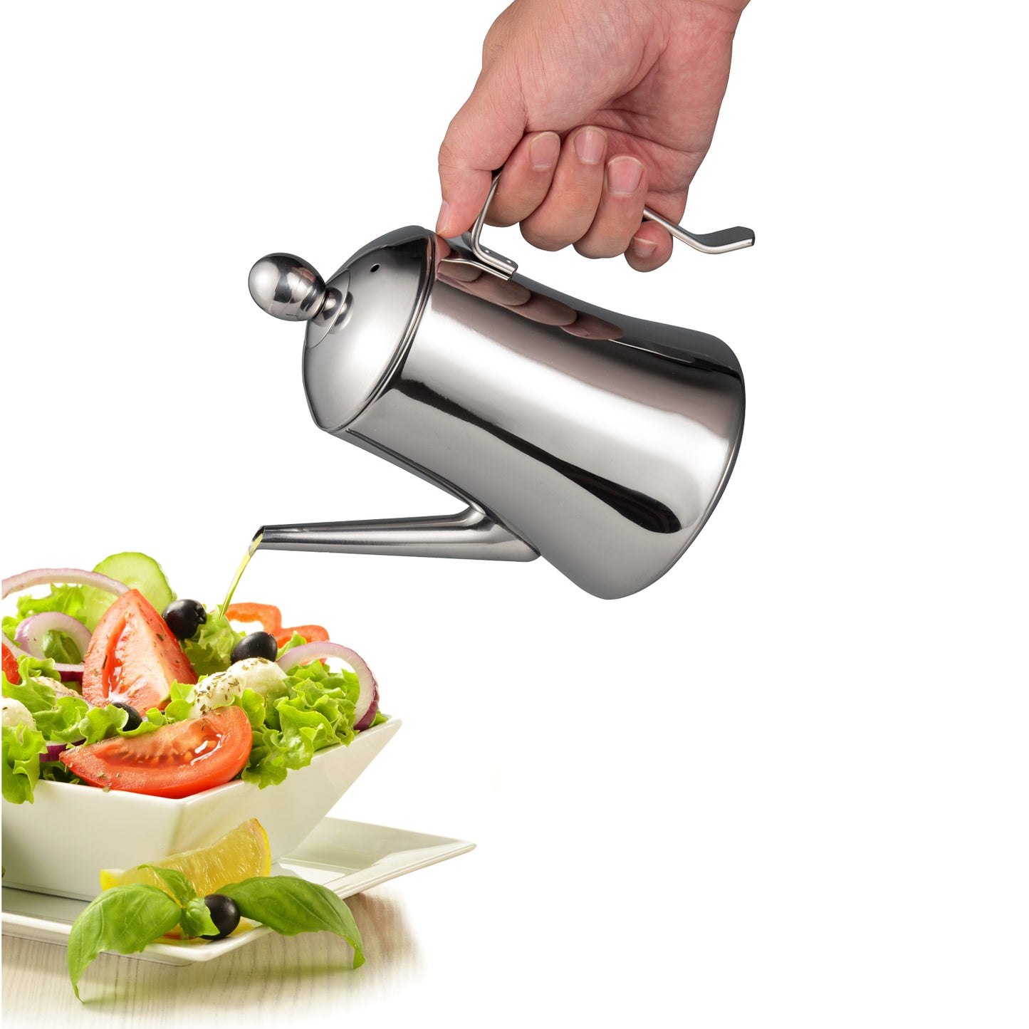 Olive Oil Dispenser pouring oil over salad with one-hand operation for convenient kitchen use
