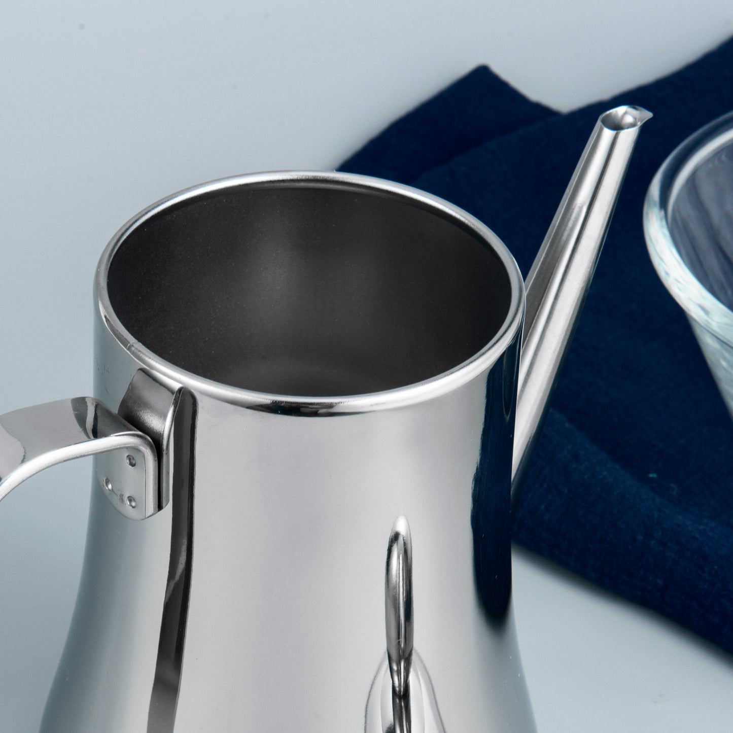 Olive Oil Dispenser detail showing smooth rounded rim and polished stainless steel surface