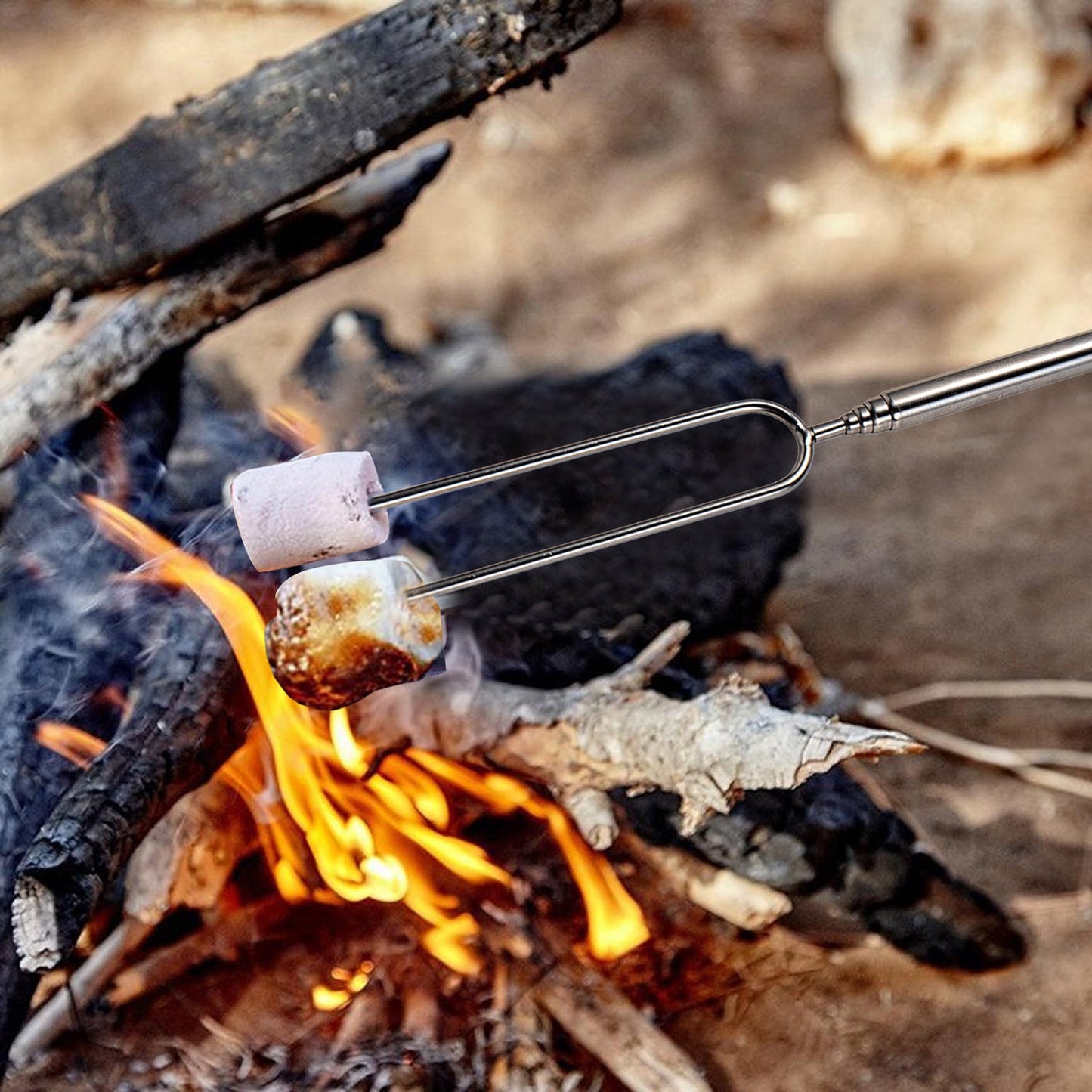 IMEEA IStainless Steel Roasting Sticks roasting marshmallows over an outdoor fire