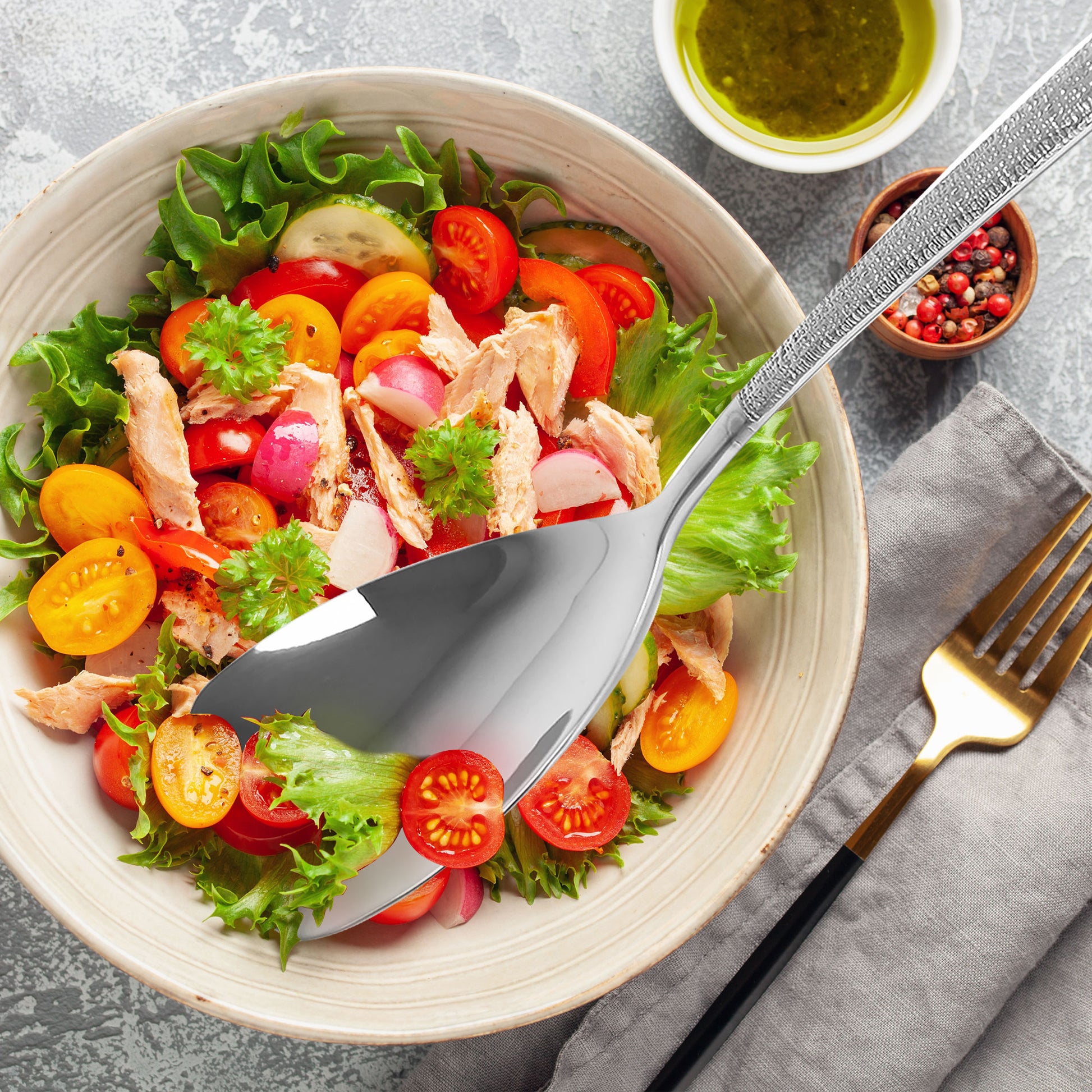 Modern Stainless Steel Buffet Spoon serving salad with a wide flat surface for easy scooping