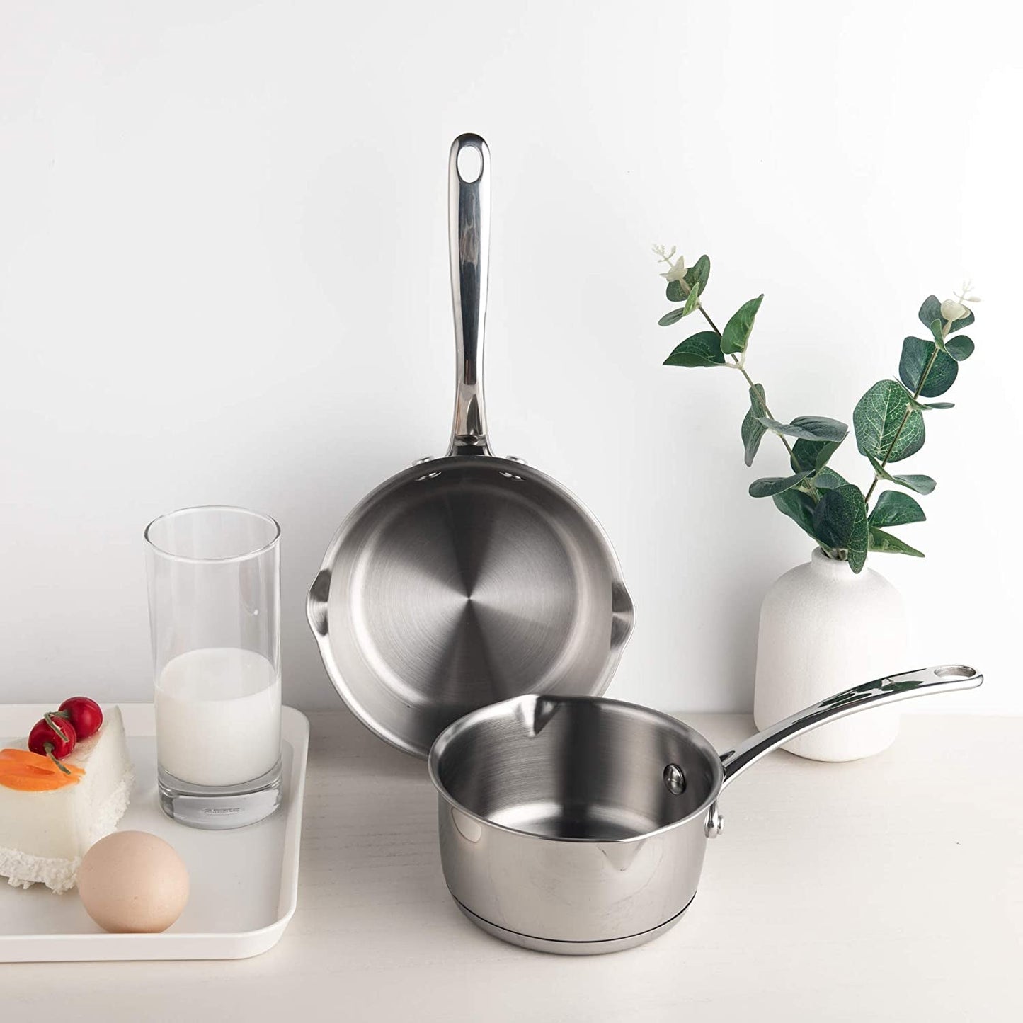 IMEEA Stainless Steel Sauce Pans arranged on a tabletop, highlighting the compact design and polished finish