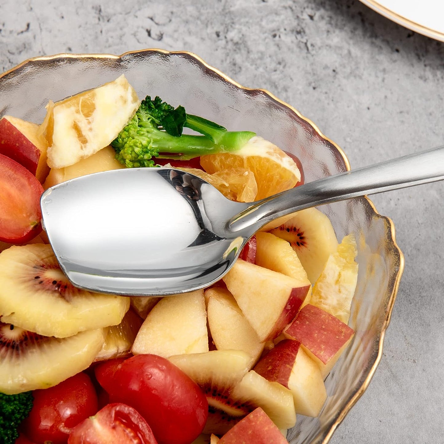 Everyday Serving Scene with IMEEA Stainless Steel Solid Serving Spoon arranged in a salad bowl for meal preparation