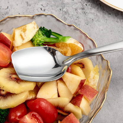 Everyday Serving Scene with IMEEA Stainless Steel Solid Serving Spoon arranged in a salad bowl for meal preparation