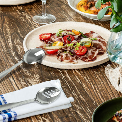 IMEEA SUS304 stainless steel serving spoon set placed beside table dishes, highlighting the long handles