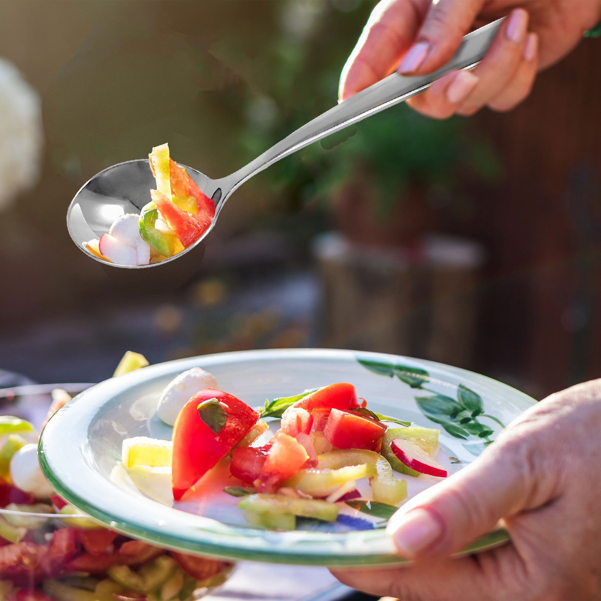 Multi-Purpose Stainless Steel Soup Spoon scooping food for everyday dining