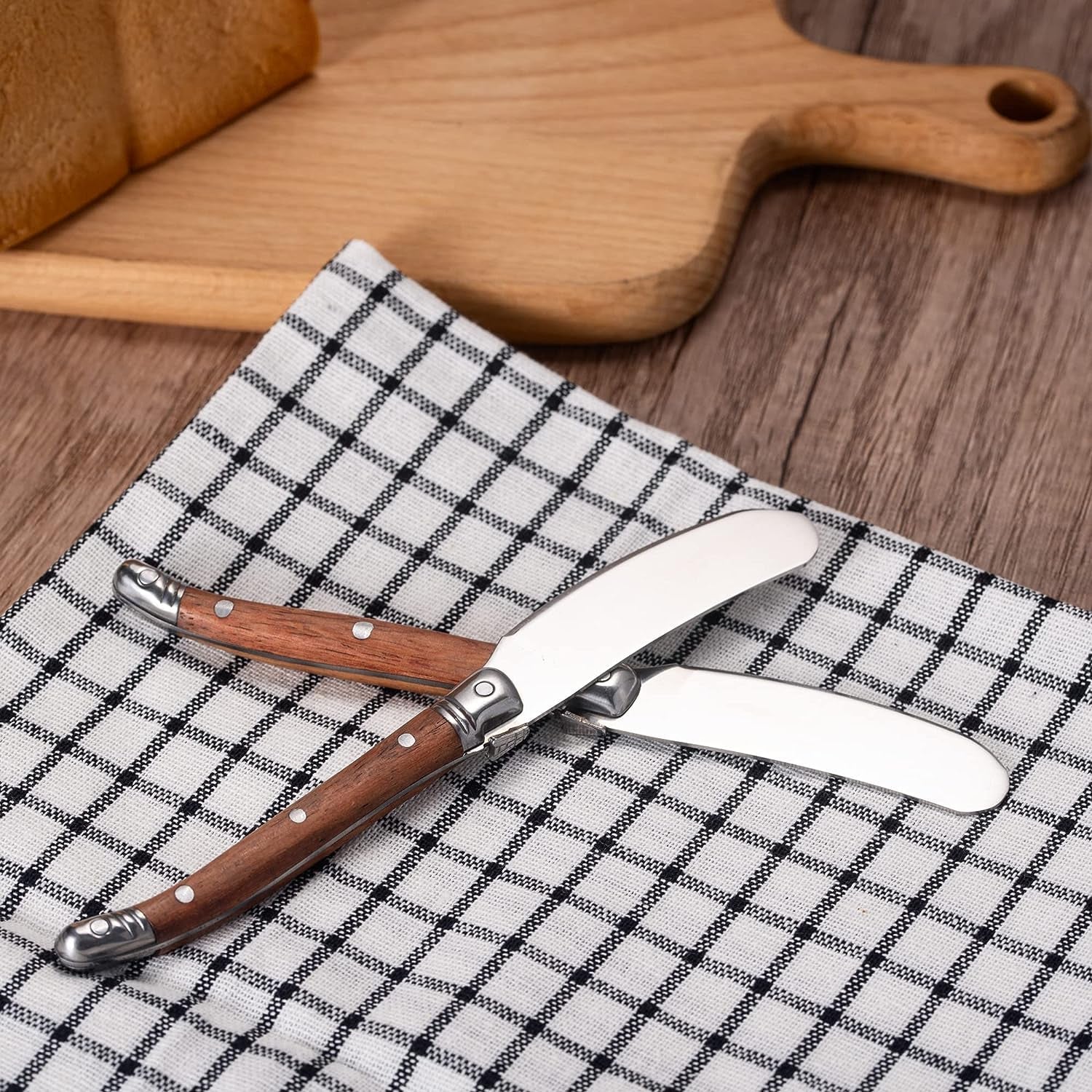 IMEEA Stainless Steel butter spreader set overlapped on a napkin