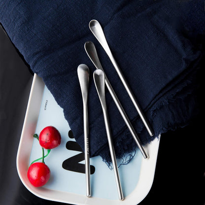 Brushed Stainless Steel Coffee Stir Spoons displayed on a plate for table setting