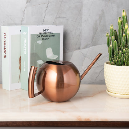 Copper Stainless Steel Watering Can placed on indoor tabletop