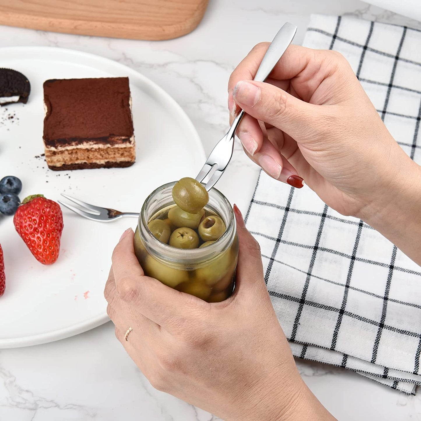 Mini Cocktail Forks  picking up an olive from a jar