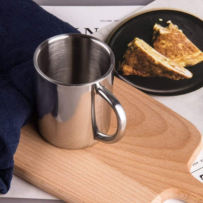 Stainless Steel Double Wall Coffee Mug Used with Breakfast Food on a Kitchen Cutting Board
