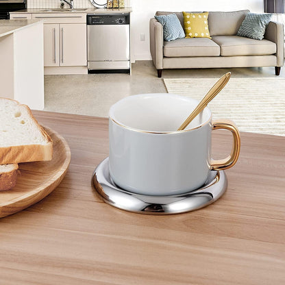 Stainless Steel Candle Holder Plate set of 2 placed under tea cups as elegant coasters