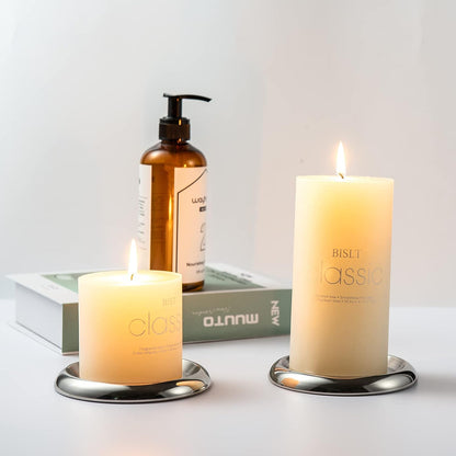 Stainless Steel Candle Holder Plate set of 2 with pillar candles on tabletop