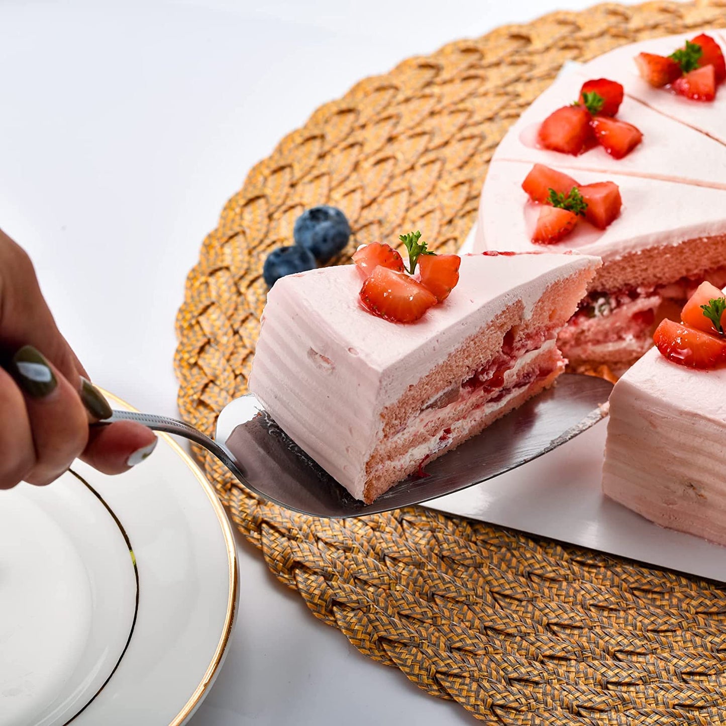 Stainless Steel cake server lifting a slice of cake, showing its use for serving desserts