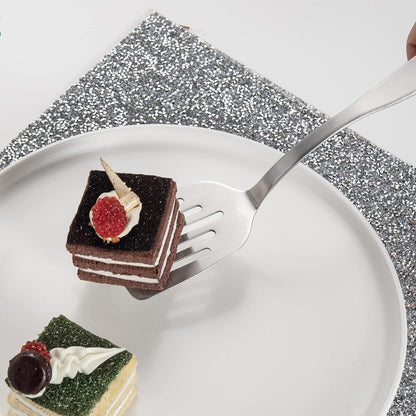 Elegant Stainless Steel Mini Dessert Spatula lifting a small cake from a serving plate