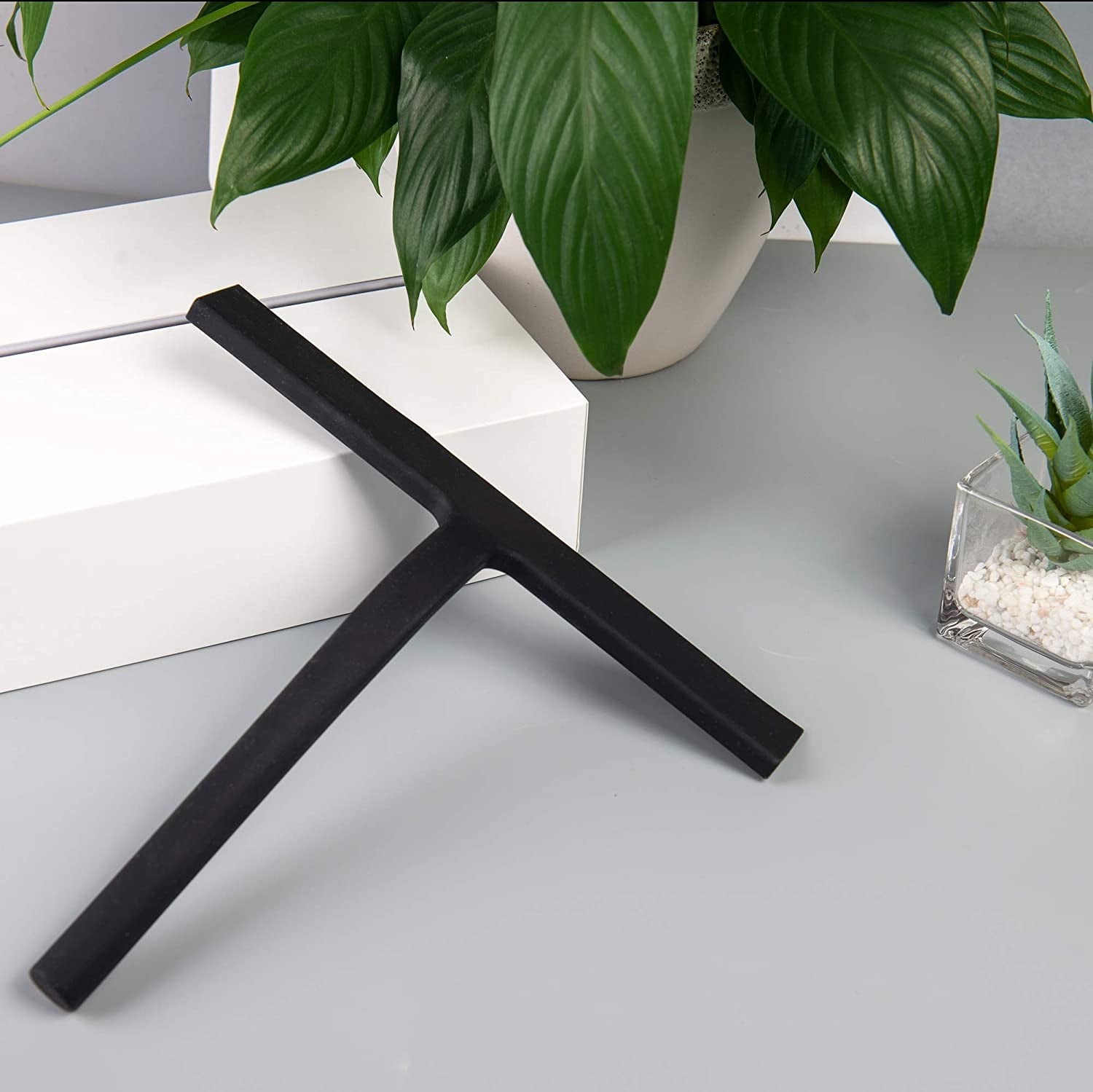 Compact Silicone Shower Squeegee 9inch placed on tabletop with a sleek modern design