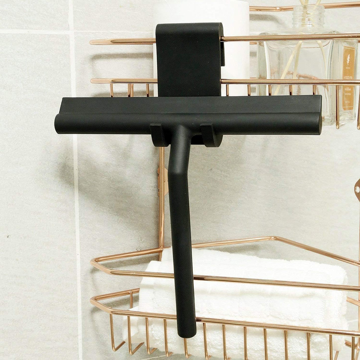 IMEEA Glass Wiper Scraper with flexible hook stored on a shower basket for convenient bathroom organization